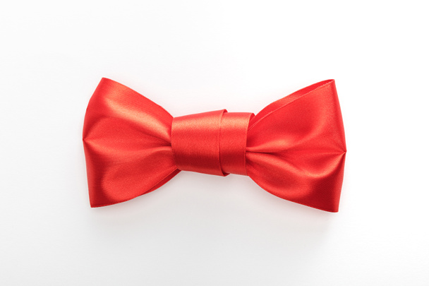 top view of red decorative satin bow isolated on white - Foto, Bild