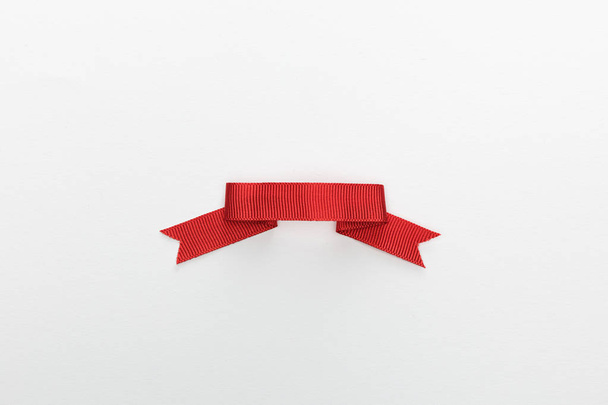 top view of red decorative ribbon isolated on white - Zdjęcie, obraz