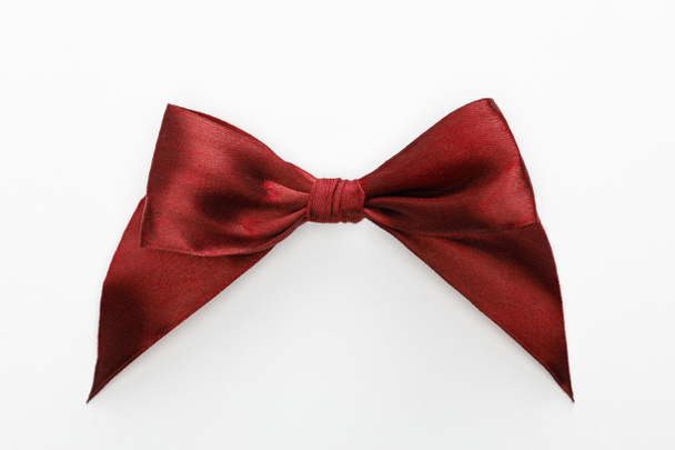 top view of satin burgundy bow isolated on white - Photo, Image