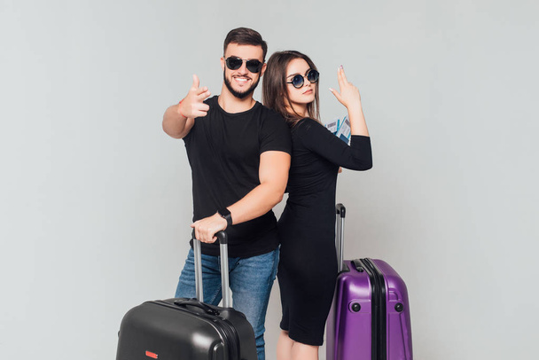 Smiling newlywed couple with suitcases and ticket isolated on white background - Foto, Imagem