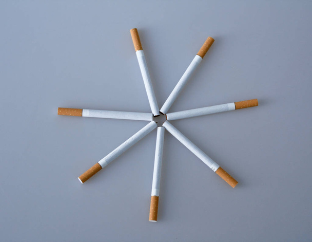 cigarette and cigarettes on a black background - Foto, Imagem