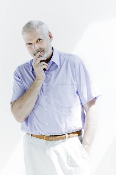 portrait of a senior man in a white shirt and tie, isolated on a light background - Foto, immagini