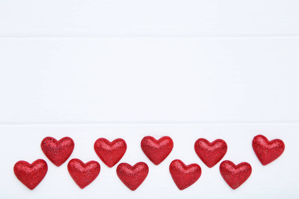 Valentine red hearts on white wooden table - Fotografie, Obrázek