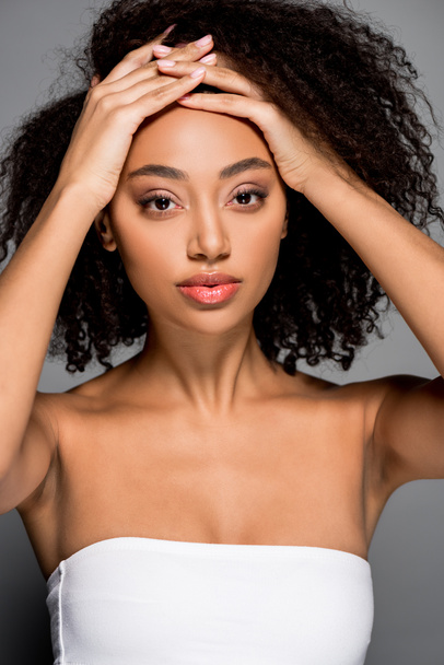 attractive curly african american girl, isolated on grey - Zdjęcie, obraz