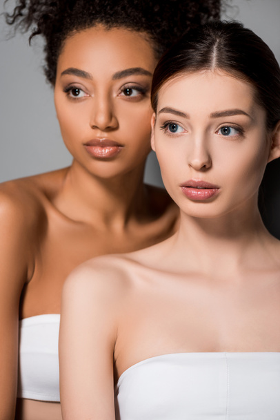 portrait of multicultural women with perfect skin, on grey - Фото, изображение