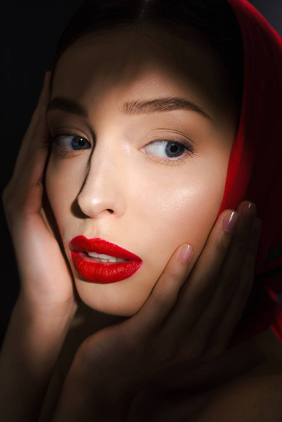 portrait of tender elegant girl with red scarf, isolated on black - Fotografie, Obrázek