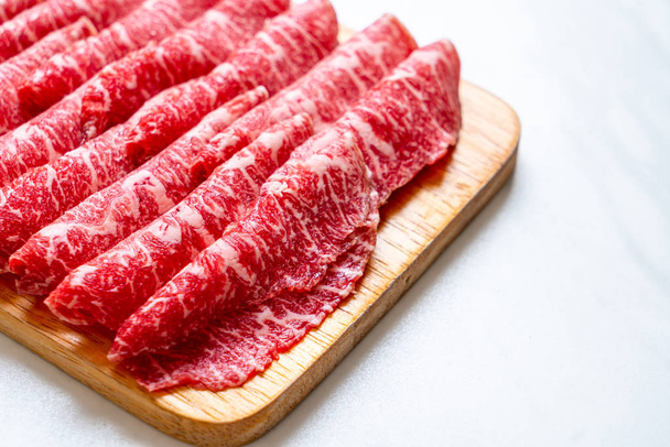fresh beef raw sliced with marbled texture - Foto, imagen