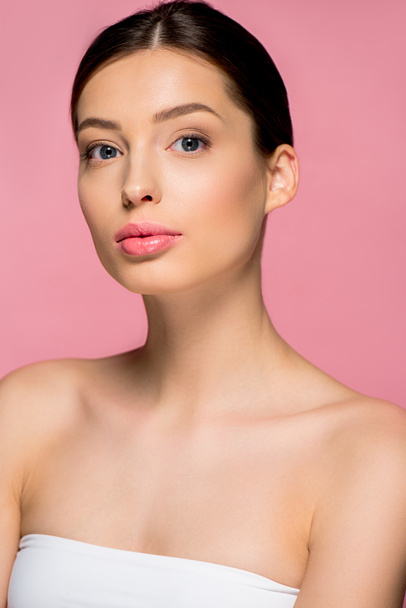 portrait of attractive girl with clean skin, isolated on pink - Foto, imagen