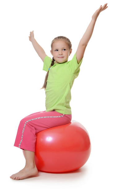 Little girl on a gymnastic ball - 写真・画像