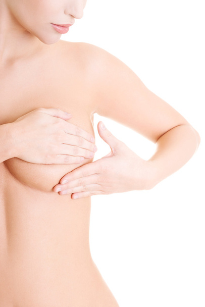 Caucasian adult woman examining her breast - Photo, image