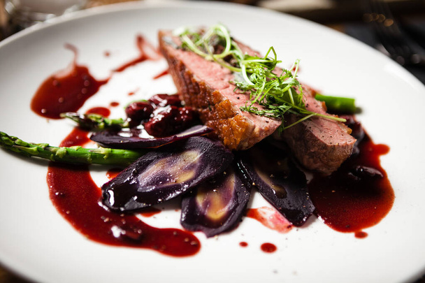 Duck breast served on a plate in restaurant - Photo, Image