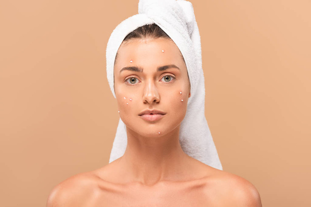 young naked woman with pimples on face looking at camera isolated on beige  - Photo, Image