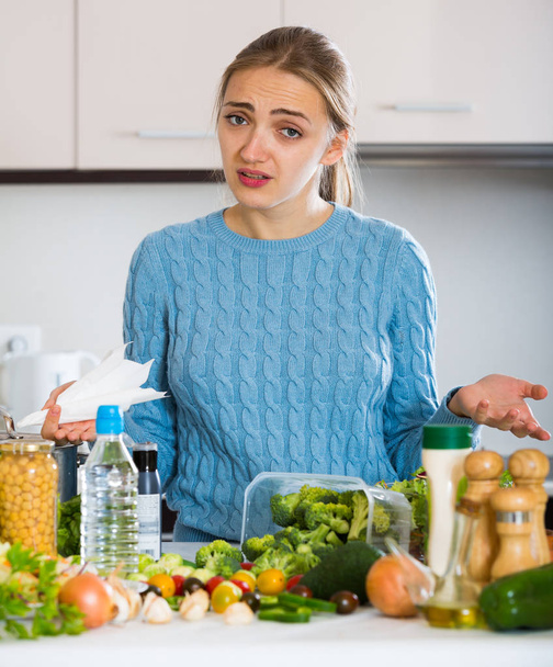 Frustrated young woman tired to cook dinner - Foto, Imagen