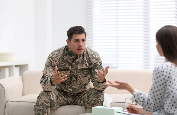 Psychotherapist working with male military officer in office - Photo, Image