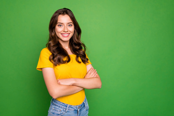 Portrait of her she nice-looking attractive lovely winsome cheerful cheery content wavy-haired girl folded arms isolated over bright vivid shine vibrant green color background - 写真・画像