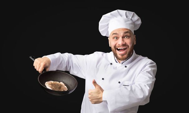 Chef Man Holding Frying Pan with Steak Gesturing Thumbs-Up, Studio - Фото, зображення