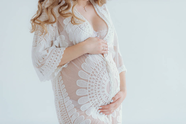 Young beautiful pregnant woman at home summer - Valokuva, kuva