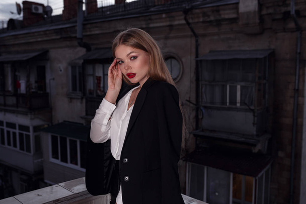 Beautiful young sexy woman, glamour girl in the black elegant jacket, suit, makeup red lipstick - Foto, Imagem