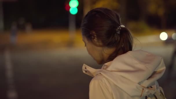 beautiful smiling young woman walking outdoors night city. - Materiaali, video