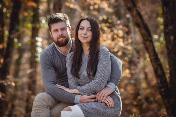 Beautiful young couple in the forest enjoying warm, good weather. - Photo, Image