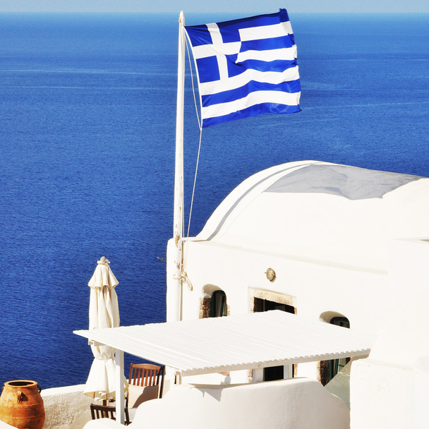 Oia falu táj görög zászló-Santorini-sziget - Fotó, kép