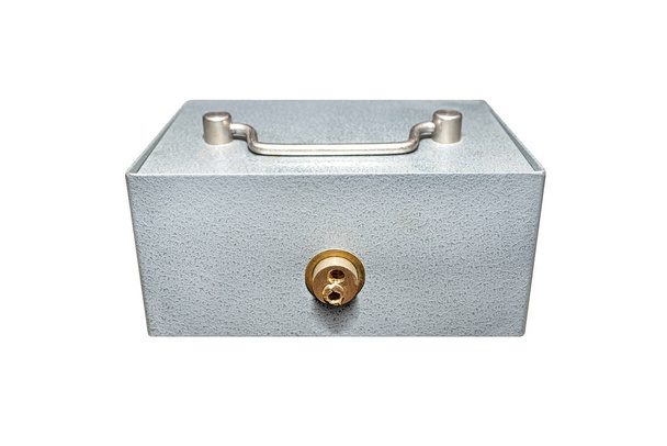 Closed, metal cash box with drilled lock, isolated on white background with a clipping path. - 写真・画像