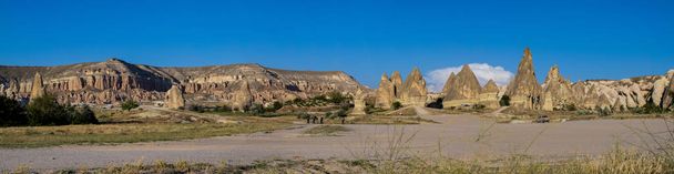 Cappadocia, Turkey, Europe: landscape of the famous region resulted from thousands of years of volcanic activity and erosion, shaping tuff, porous rock formed by volcanic debris, into unexpected forms - Photo, Image