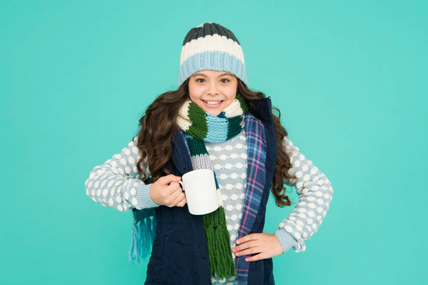 made for cold weather. more ideas for warming. happy girl hipster. kid winter fashion. feeling good any weather. Stay active this season. kid warm knitwear. child hot tea cup. Have warming drink - Photo, image