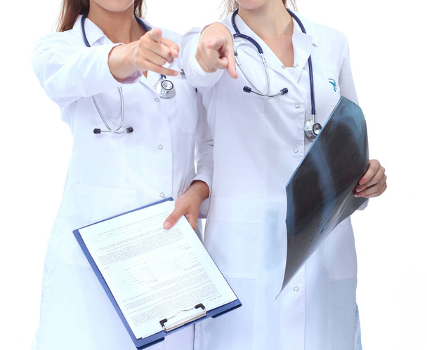 Two woman nurse watching X Ray image, standing in hospital. X Ray . Two woman doctor - Foto, Imagen