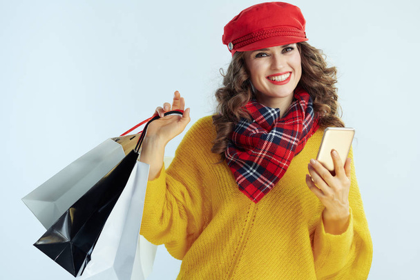 woman shopper with smartphone driving growth of social media - Foto, Bild