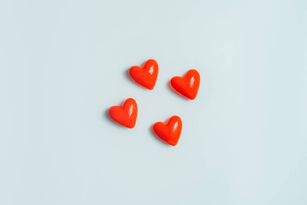Close up view of four  hearts on a gray background.  - Фото, изображение