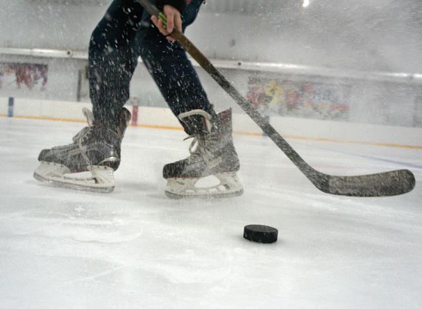  hockey player with stick and puck - Photo, Image