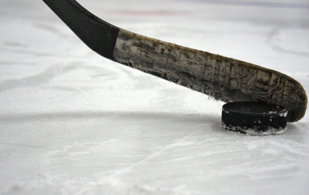 hockey stick with puck in the stadium - Photo, Image