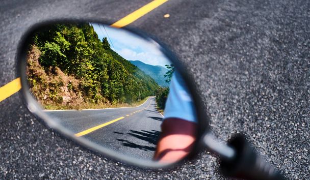 Perfect road trip in Vietnam, guy looking in the mirror - Photo, Image