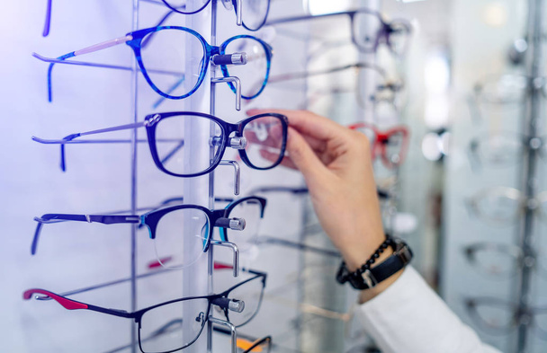 Eyeglasses shop. Stand with glasses in the store of optics. Woma - Fotó, kép
