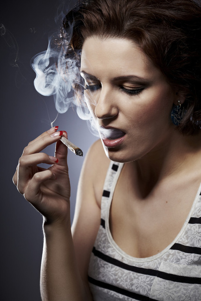 Lady using smoking drugs - Photo, image