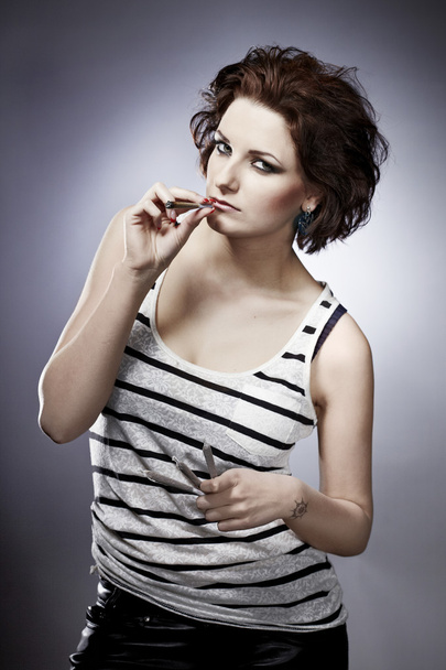 Lady using smoking drugs - Фото, изображение