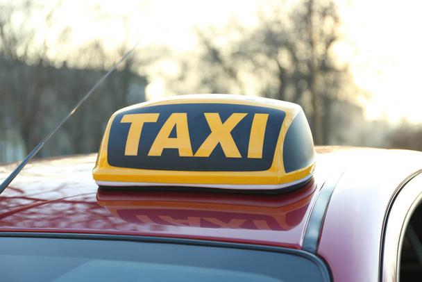 Roof light with word TAXI on car outdoors - Photo, Image