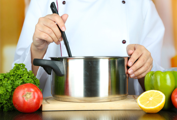 Cook hands and pan at workplace - Foto, Bild