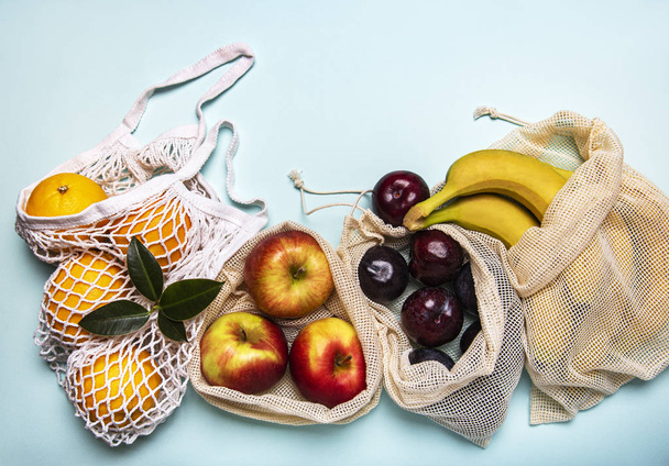 Mesh shopping bags with fruits - Photo, Image