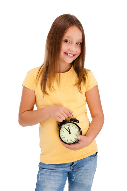 Girl holding alarm-clock - Фото, изображение