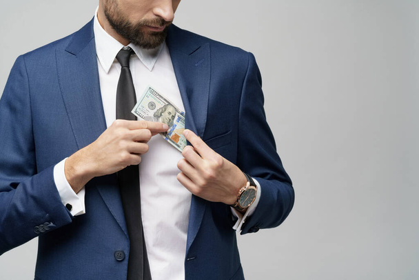 young handsome businessman holding US dollar bill - Zdjęcie, obraz