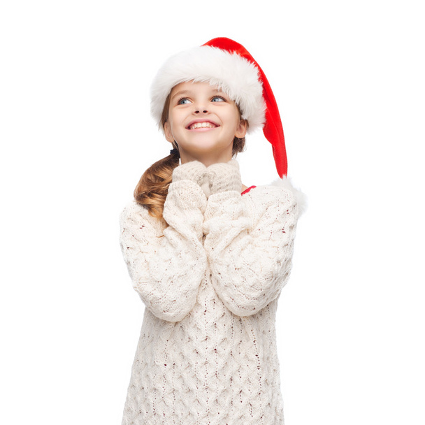 Dreaming girl in santa helper hat - Valokuva, kuva