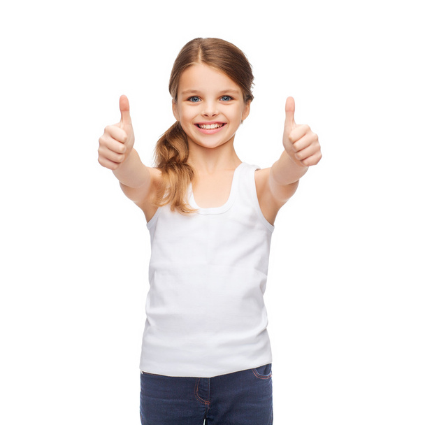 Girl in blank white shirt showing thumbs up - Foto, afbeelding