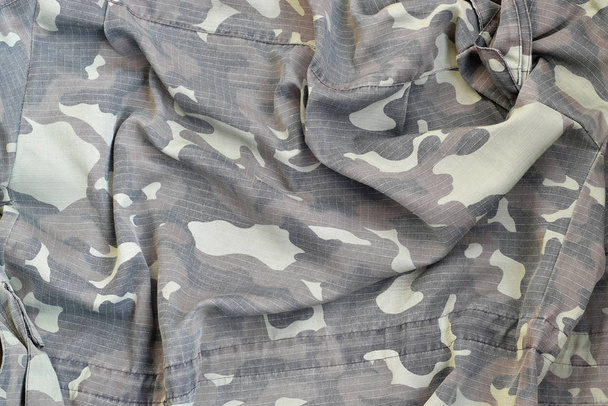 Camouflage background texture as backdrop for hunting or fishing design projects - Photo, Image