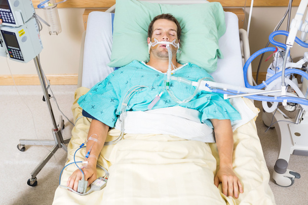 Patient With Endotracheal Tube Resting In Hospital - 写真・画像