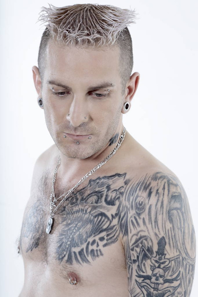 man with piercing and tattoos - Φωτογραφία, εικόνα