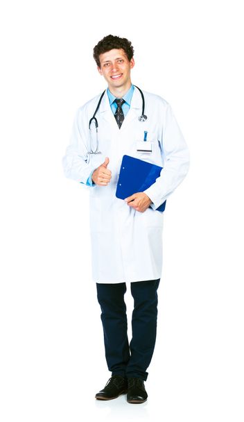 Portrait of a smiling male doctor holding a notepad and finger u - Fotografie, Obrázek