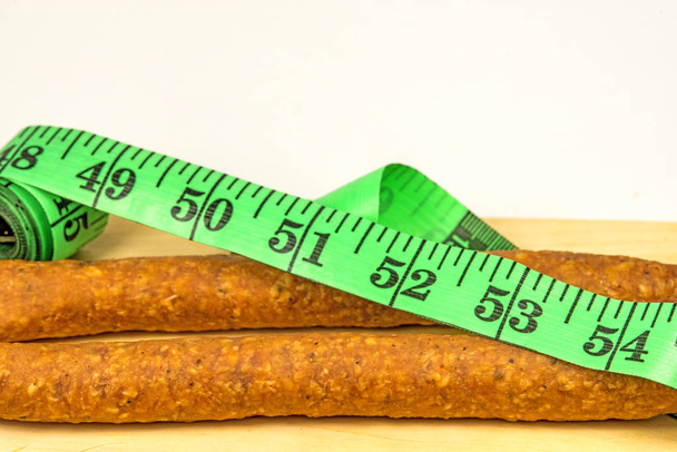 sausage with a tape measure - Photo, Image