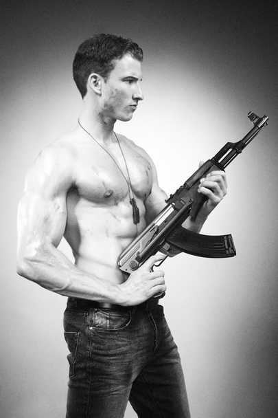 Power muscle man with AK-47 gun - Fotó, kép